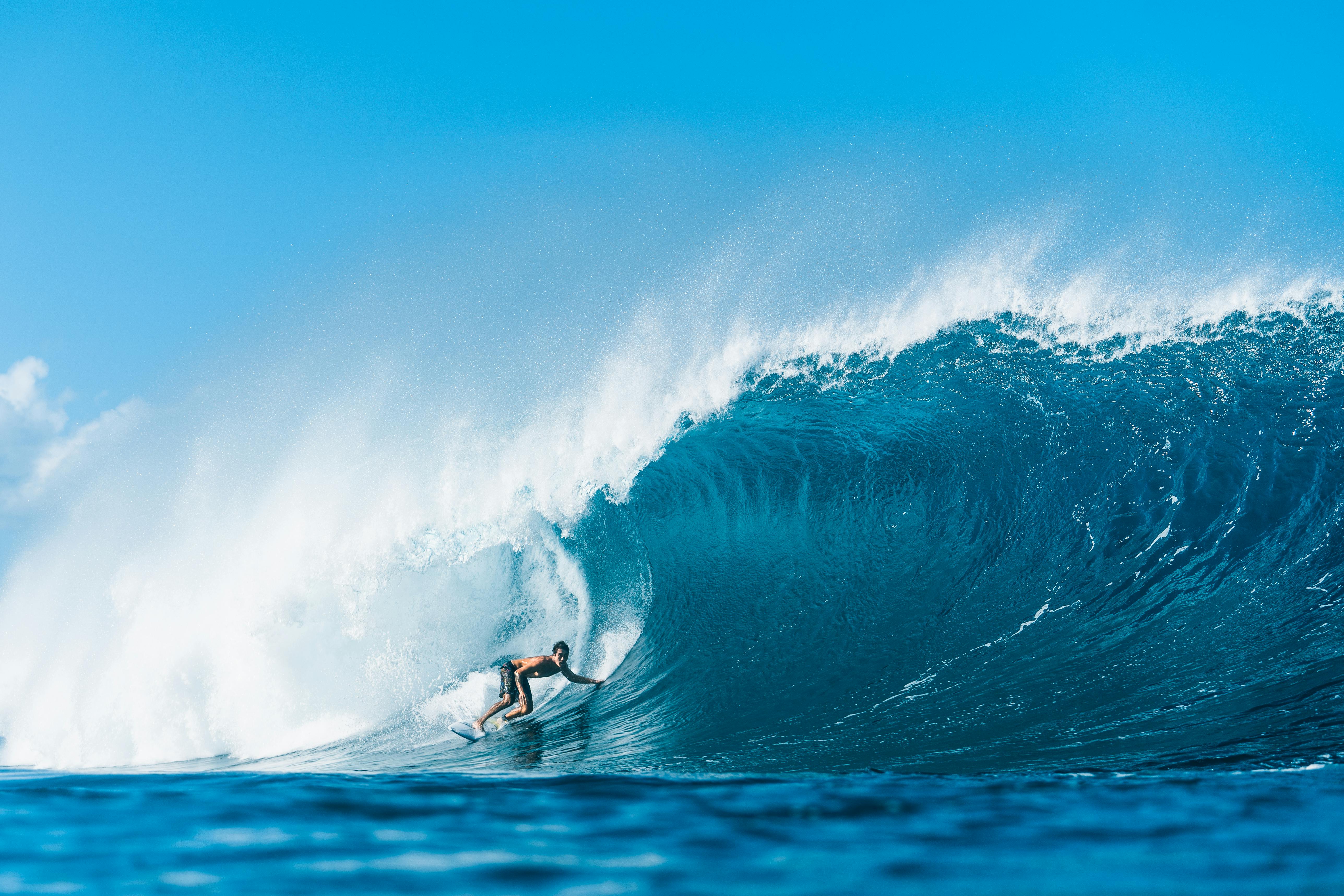 A surfer riding a big wave